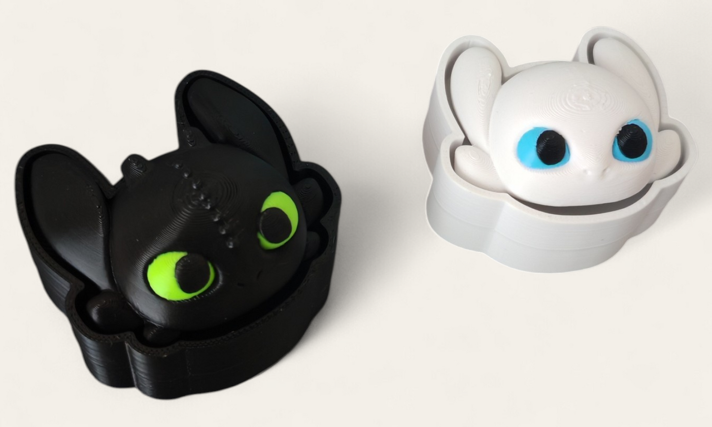 Clickers de desdentado y furia luminosa Kokoroto, dispositivos de entrenamiento con luz y sonido, en color negro y rojo.