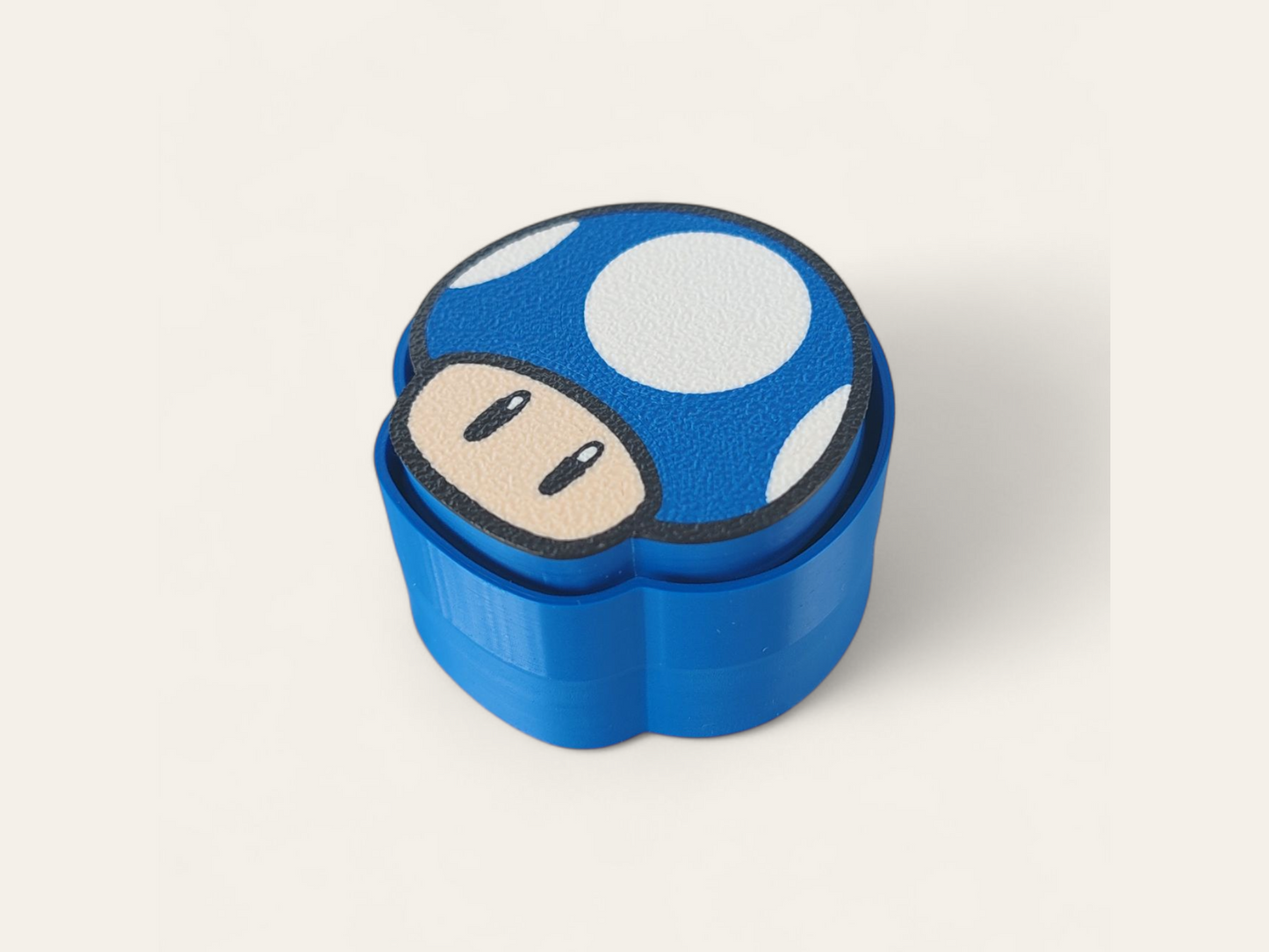 Clicker Power-Up Mario Bros de Kokoroto, botón de juego en color rojo con detalles de personajes de Mario Bros.