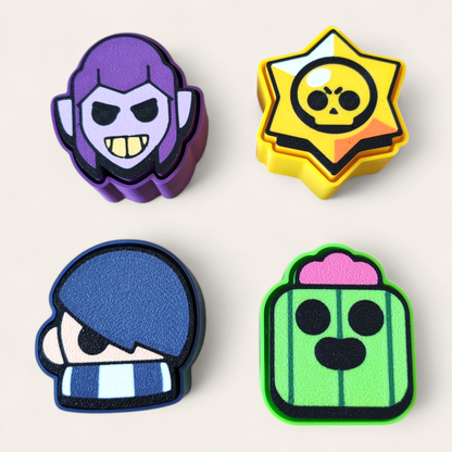 Clickers inspirados en Brawl Stars de la marca Kokoroto, con diseño colorido y detalles temáticos del juego.