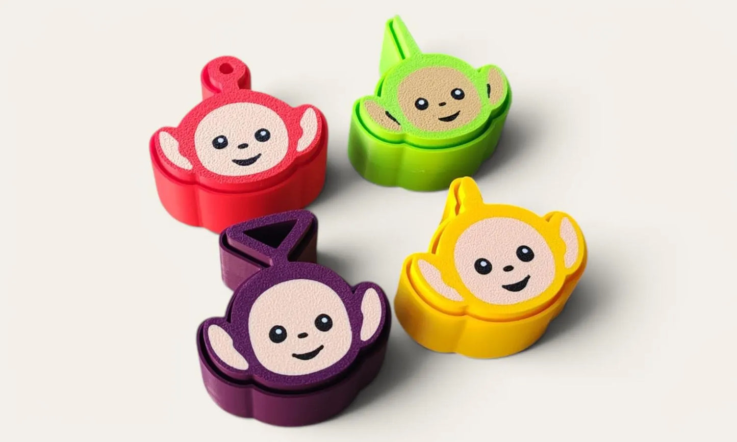 Clickers de los Teletubbies de la marca Kokoroto, en colores brillantes, con diseño divertido y tamaño compacto para niños.
