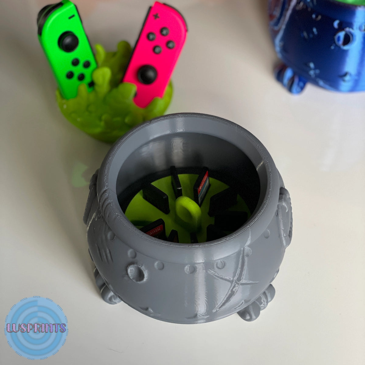 Top view of the witch's cauldron showing the rotating interior compartment for storing Nintendo Switch cartridges - Kokoroto