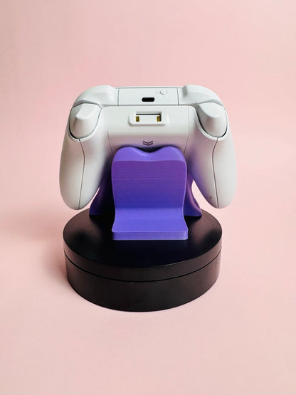Soporte universal para mandos Kokoroto, soporte resistente para controles de videojuegos, en color negro y diseño compacto.