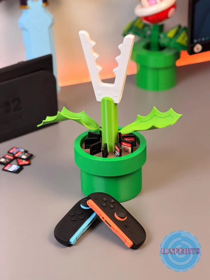 Soporte de planta Piraña para Joy-Cons de Nintendo Switch 2 de la marca Kokoroto, con diseño de Piraña de Mario.