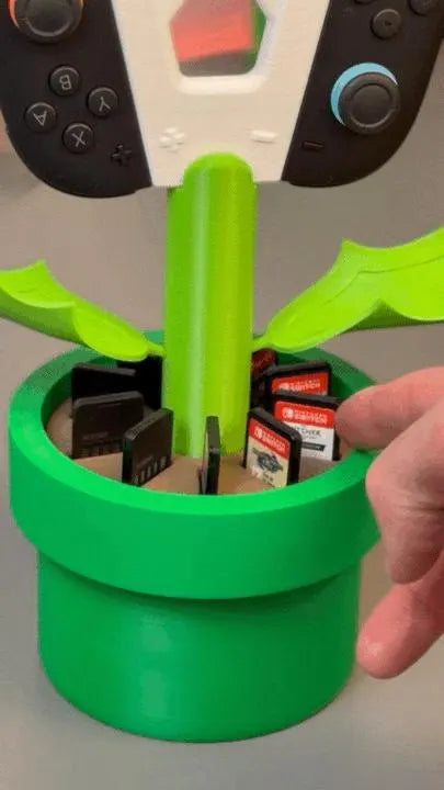 Soporte de planta Piraña para joy-cons de Nintendo Switch 2 de la marca Kokoroto, con diseño de Piraña de Mario.