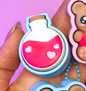 Diseño de llavero clicker con frasco de poción de amor para San Valentín - Kokoroto